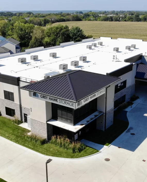 Aerial view of a white commercial roof with rooftop equipment